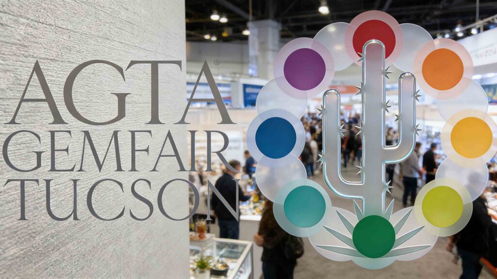 A busy exhibition floor at AGTA GemFair Tucson showcasing natural colored gemstones, with buyers and suppliers examining sapphires, emeralds, and rubies.