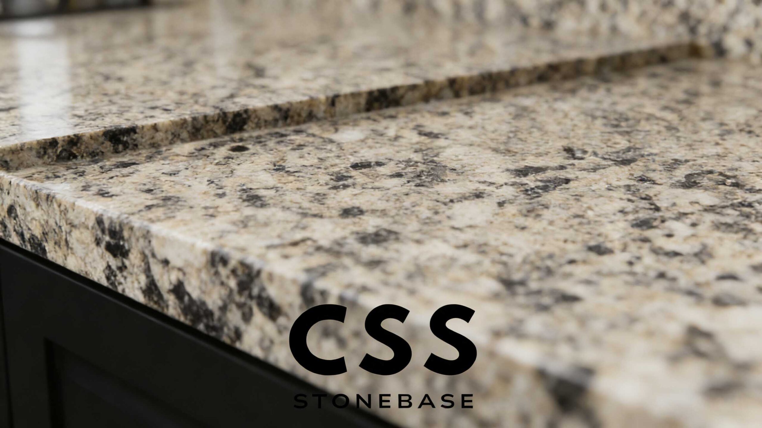 Desert Brown Granite blocks in a stone yard, showing natural brown veining for slab production, countertops, tiles, and cladding.