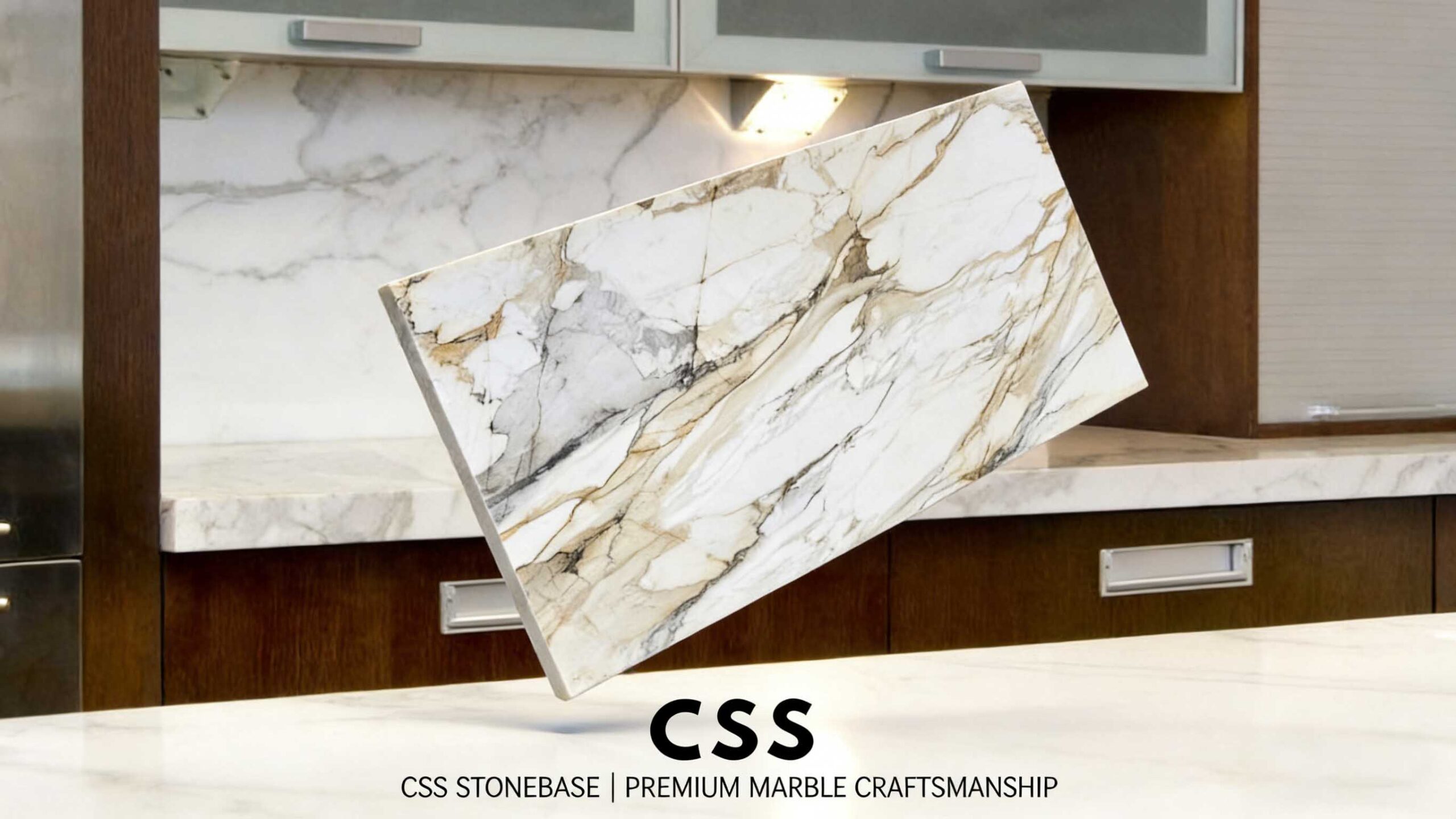 Calacatta Gold marble used as a primary architectural surface in a luxury interior, featuring a bright white background and expressive gold veining