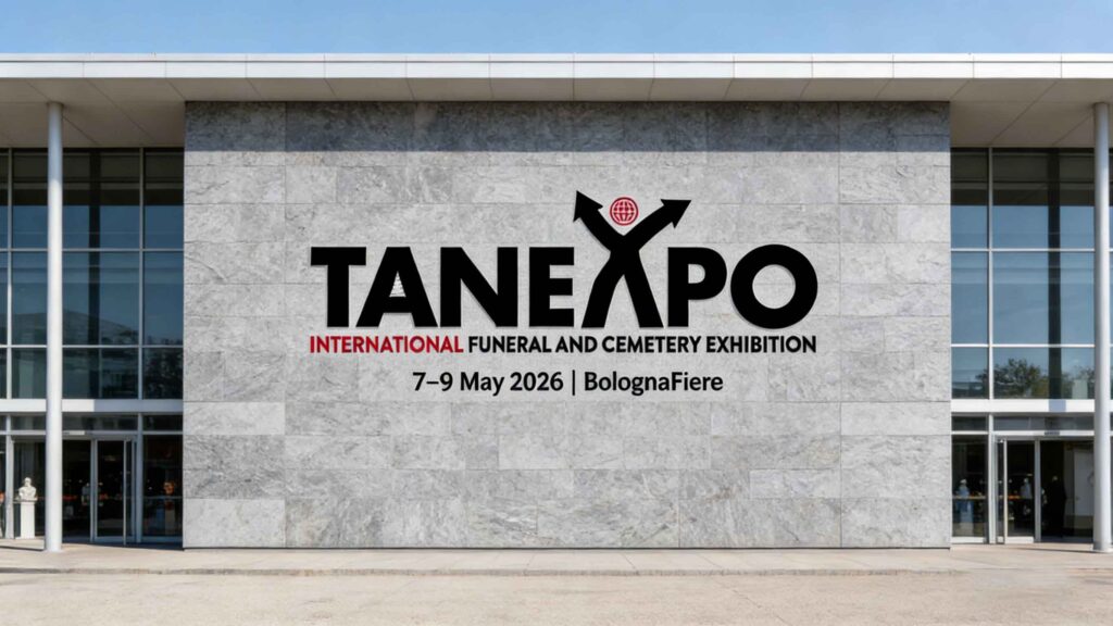 TANEXPO 2026 exhibition floor in Bologna showing funeral and cemetery products, memorial stone displays, and cremation equipment demonstrations