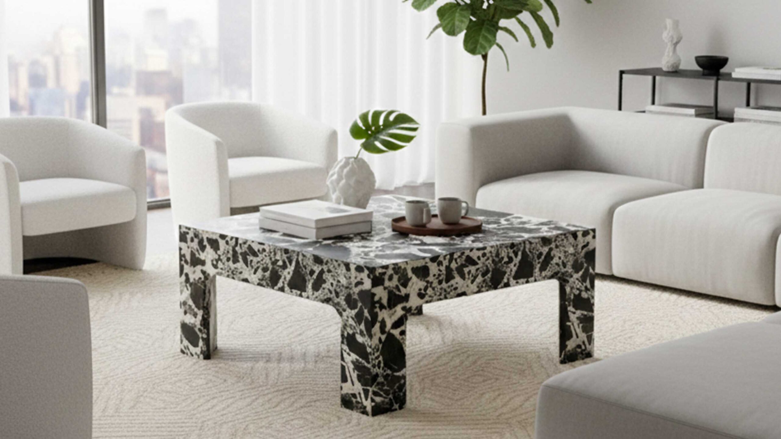 Napoleon Black natural marble coffee table styled in a modern European living room.