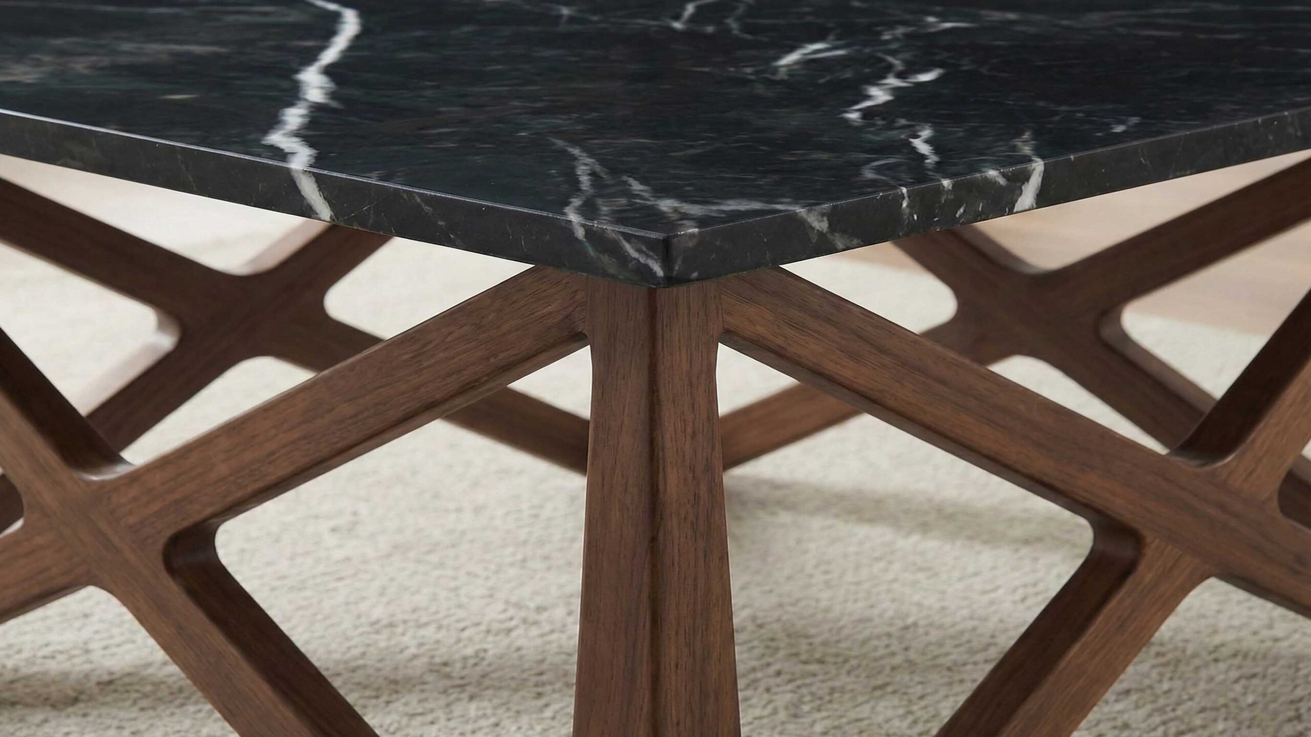 Square marble coffee table top orientation aligned with sofa and rug layout.