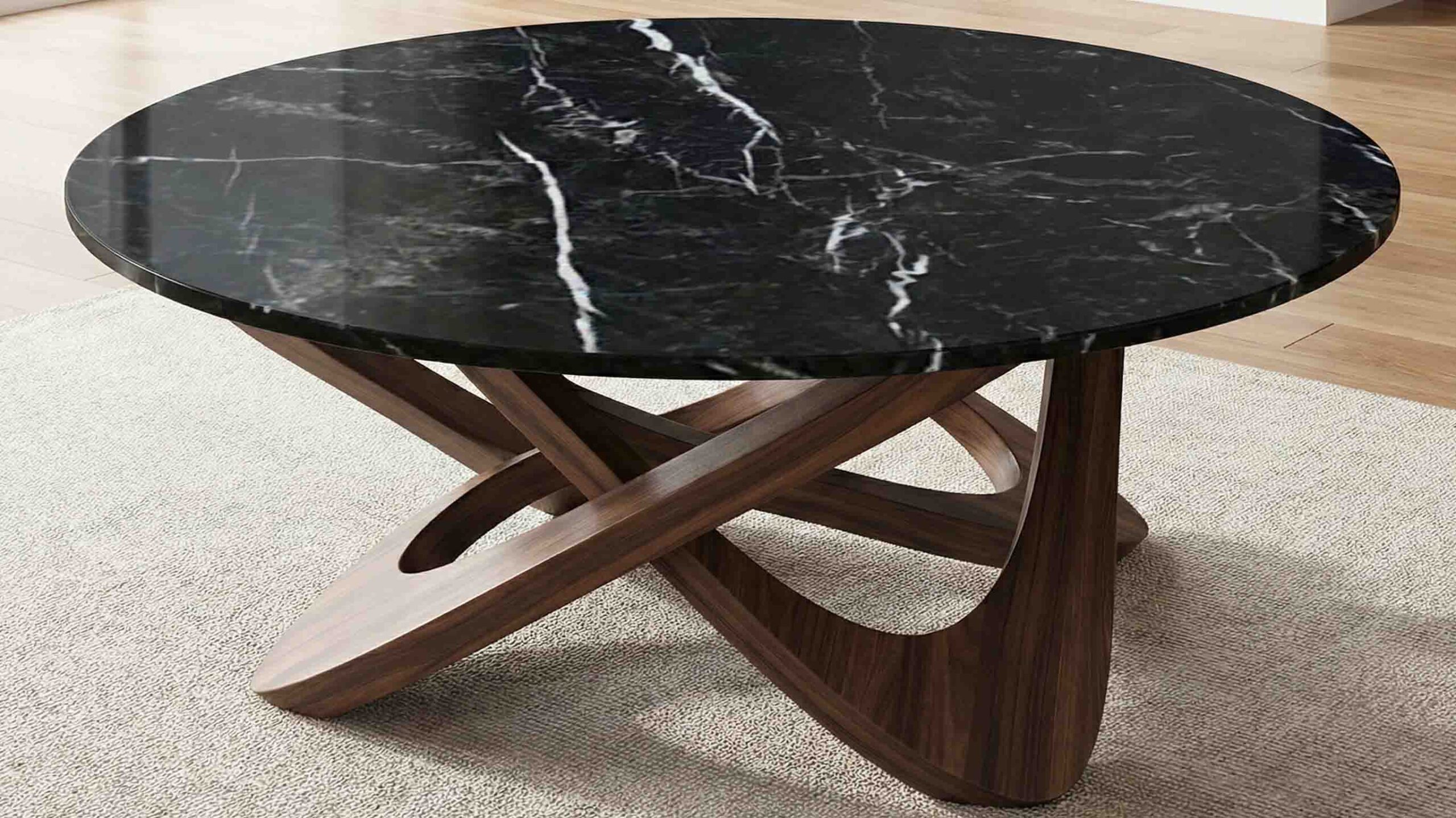 Polished Nero Marquina marble coffee table top showing high-contrast black and white pattern.