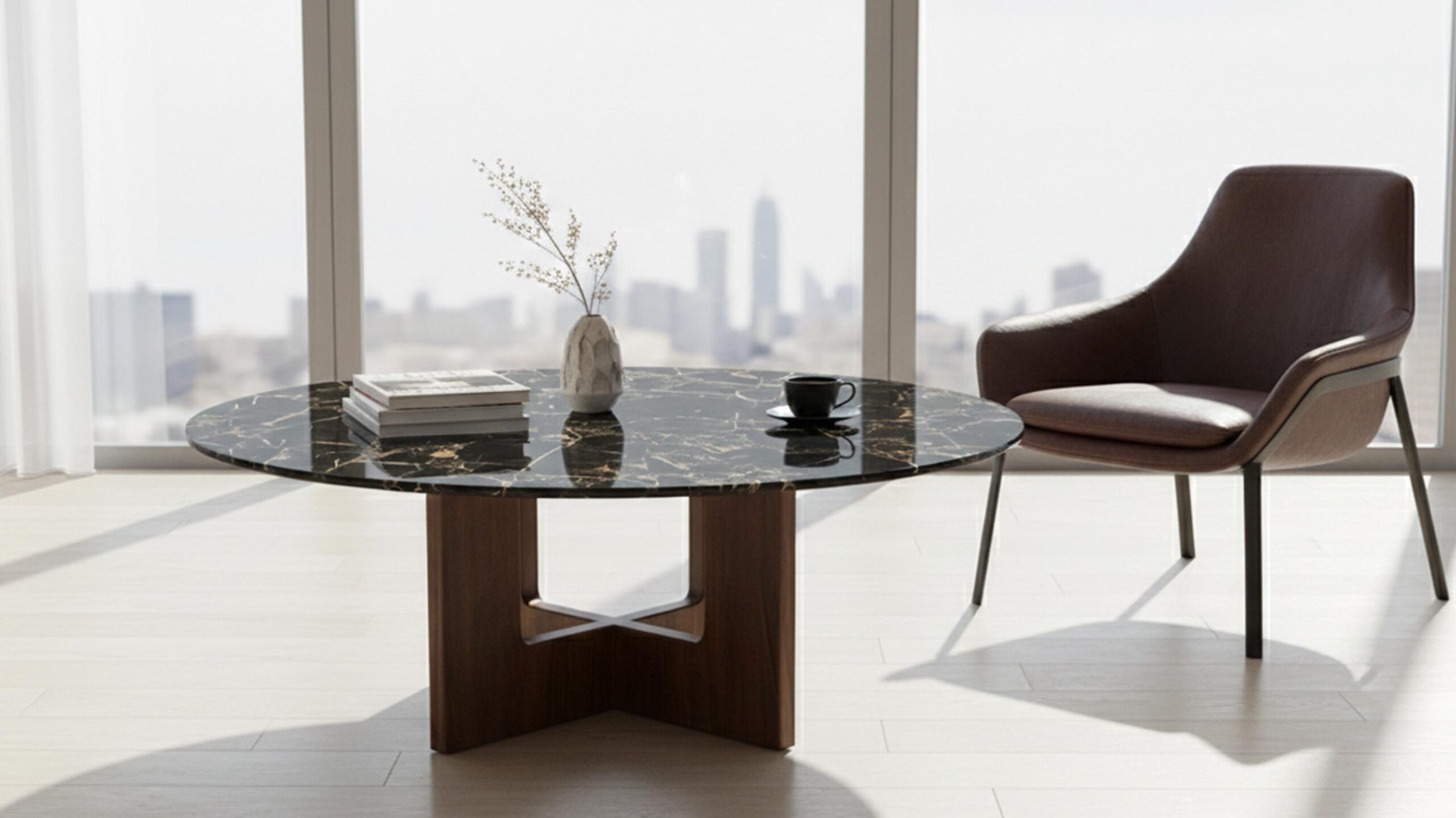 Portoro marble coffee table top with natural black base and gold veining styled in a boutique-hotel inspired modern living room