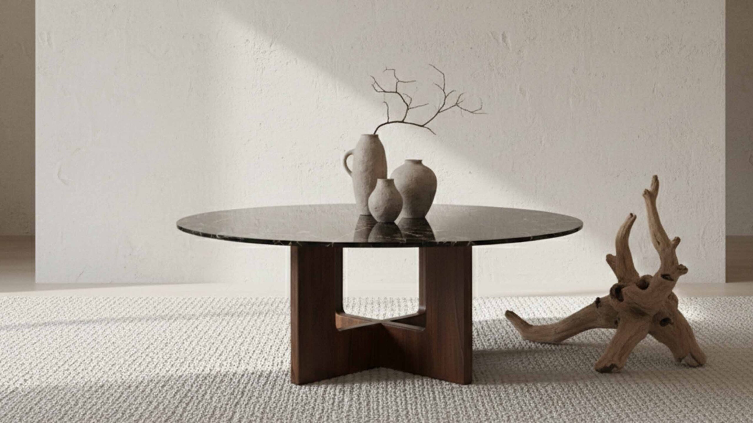 Styled Portoro marble coffee table with books, tray, and brass decor elements