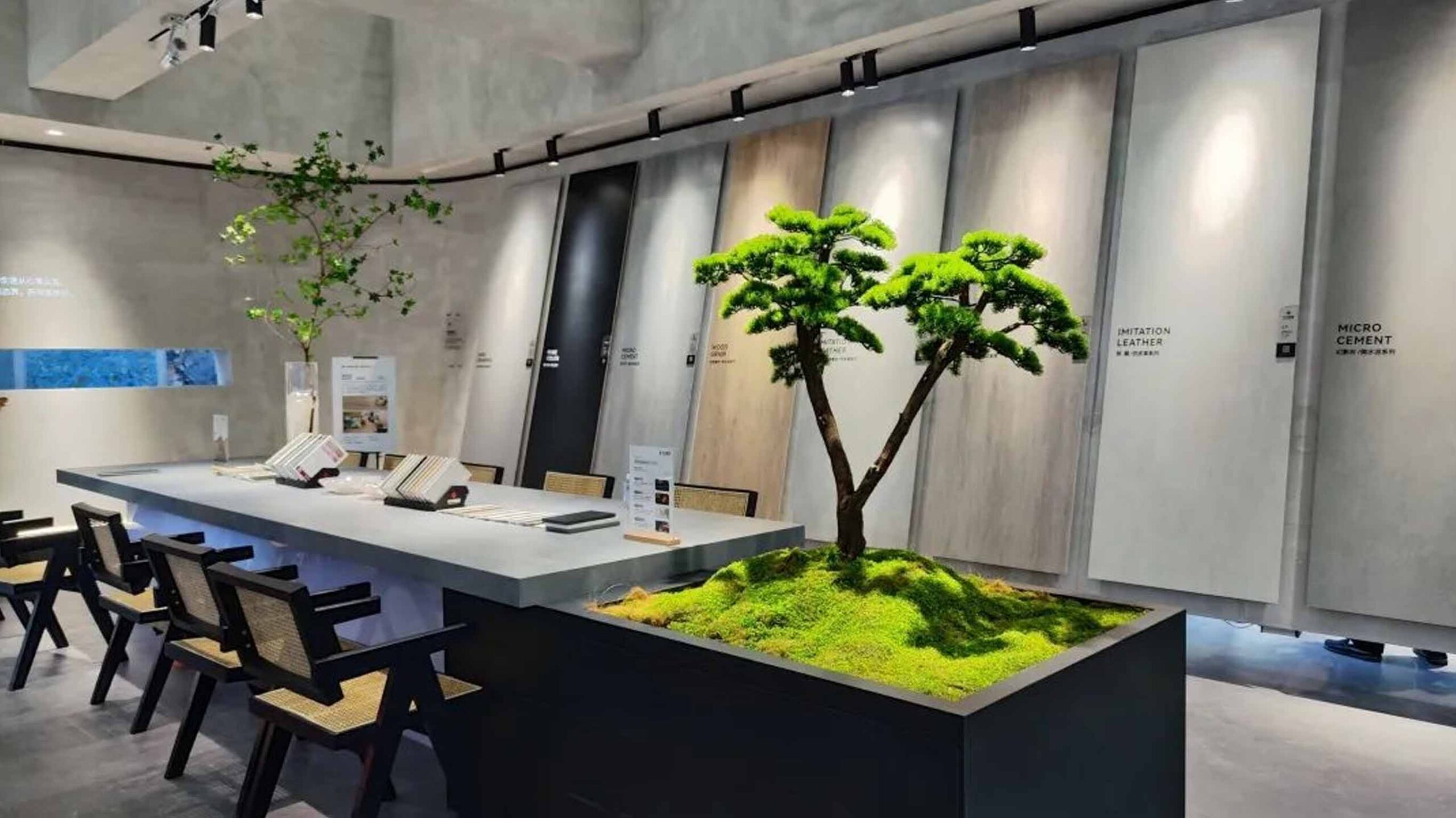 Wholesale buyer team planning a factory sourcing route at Xiamen Stone Fair 2026 using hall map and phone